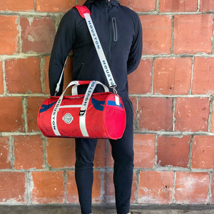 Man-Standing-with-Houston-Duffle-Cooler