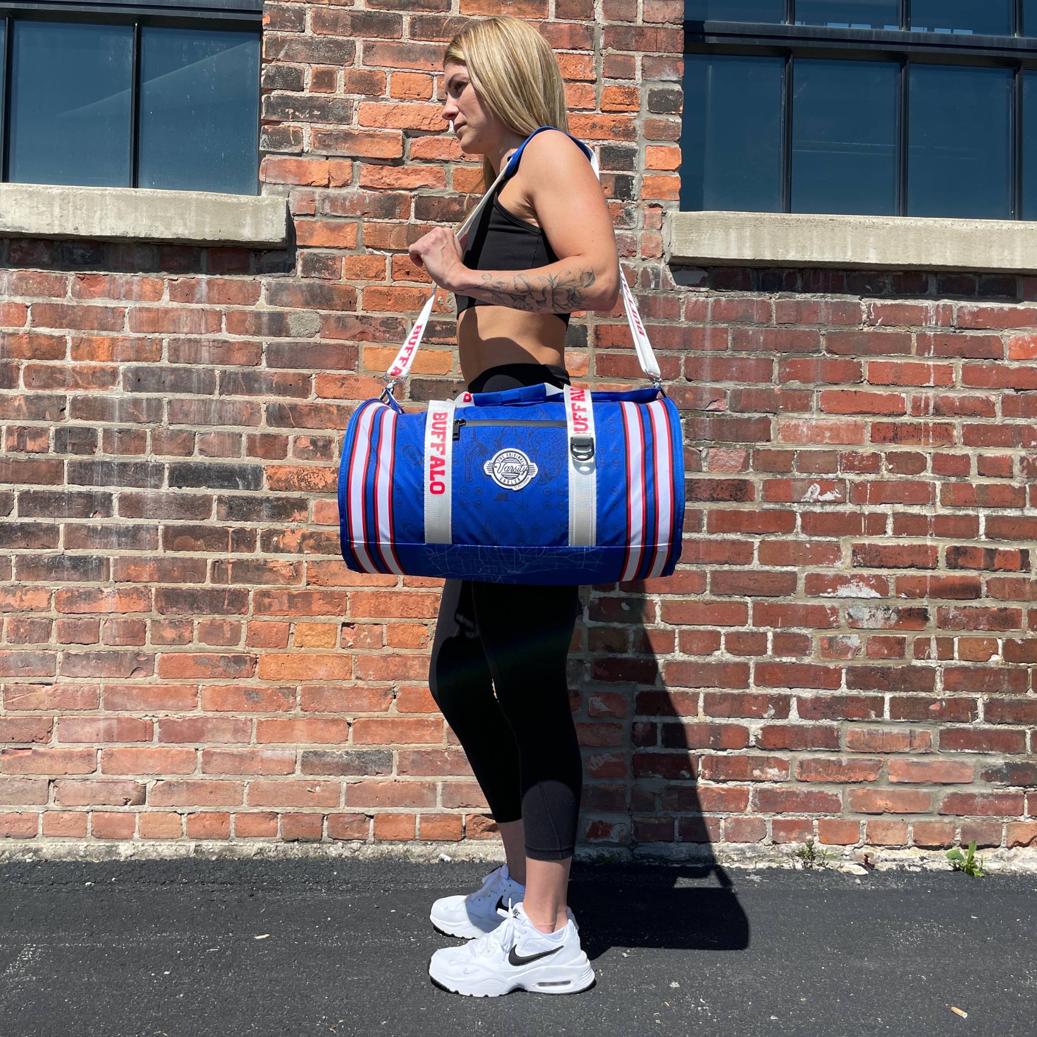 Girl Standing With Bufffalo Duffle Cooler