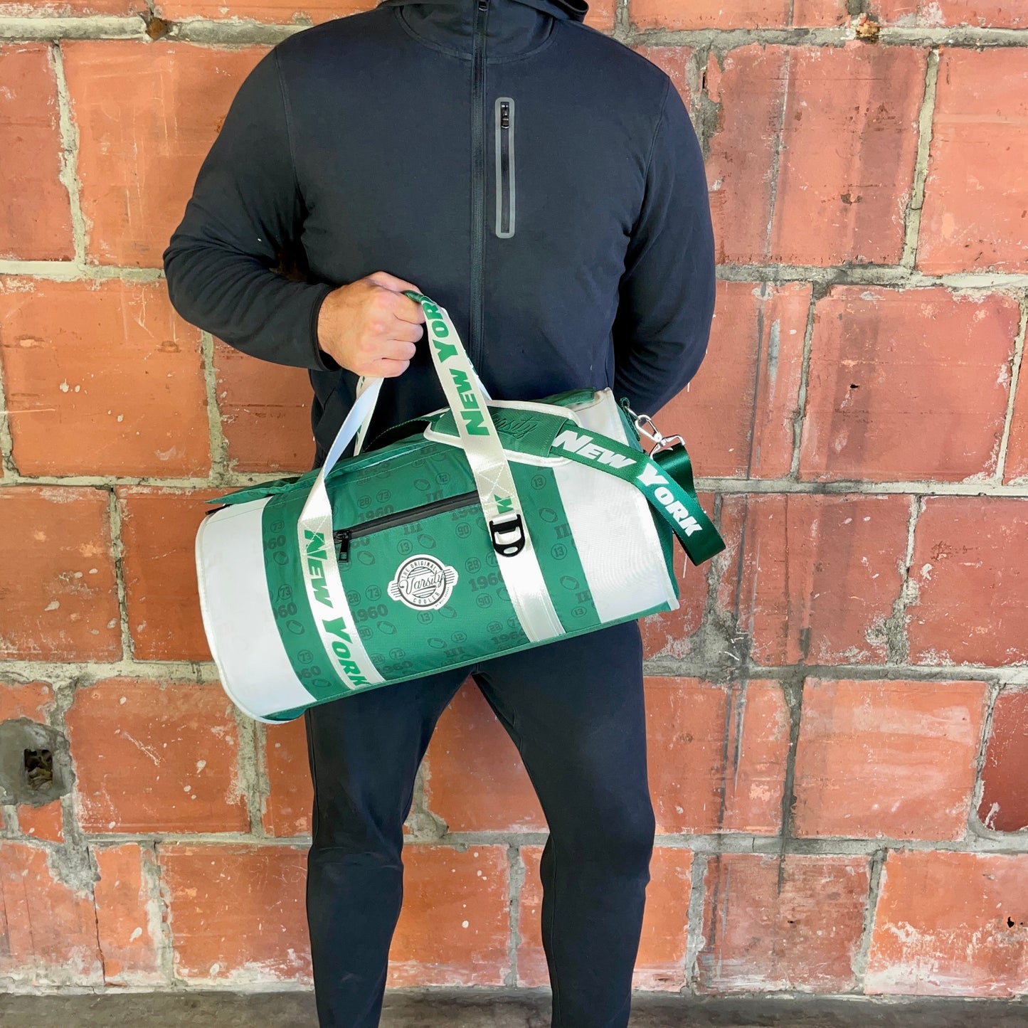 Man holding New York duffle cooler