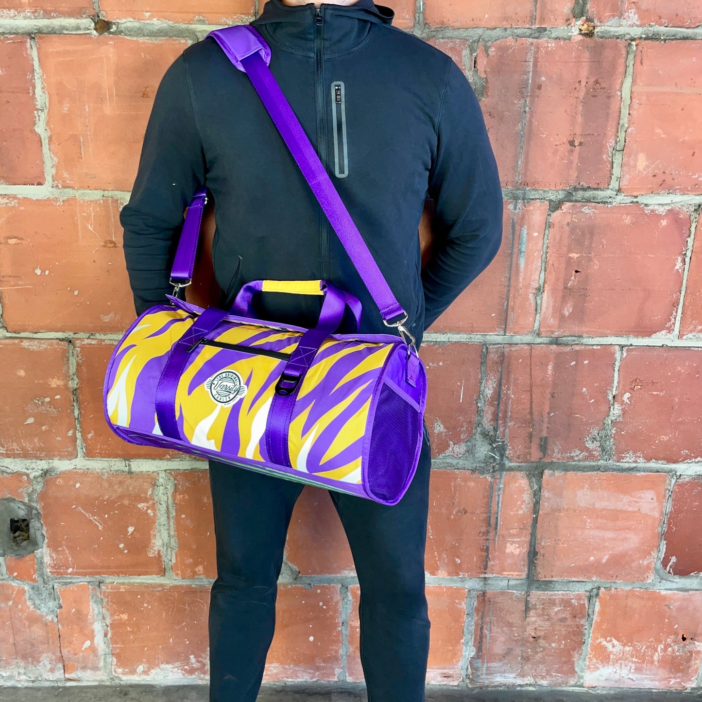 Man Standing With Louisiana Cooler Duffle Bag