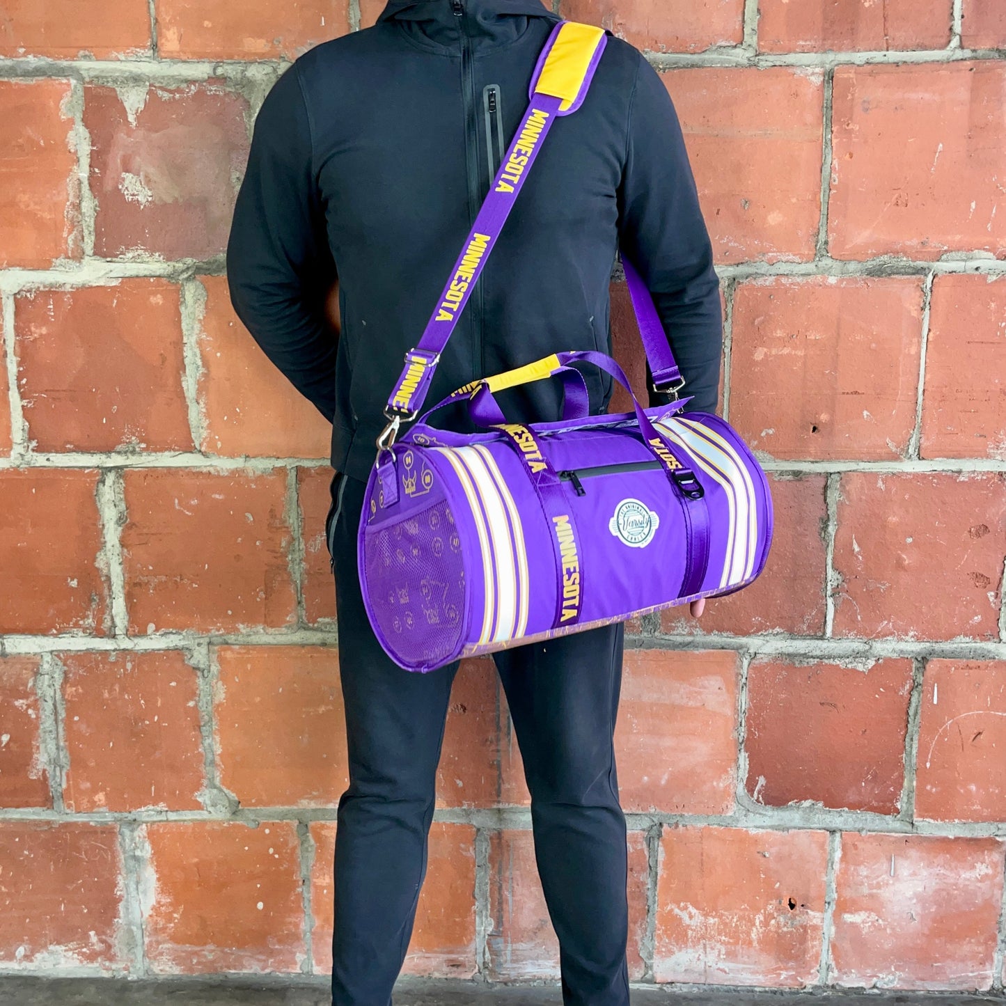 Man standing with Minnesota duffle bag cooler