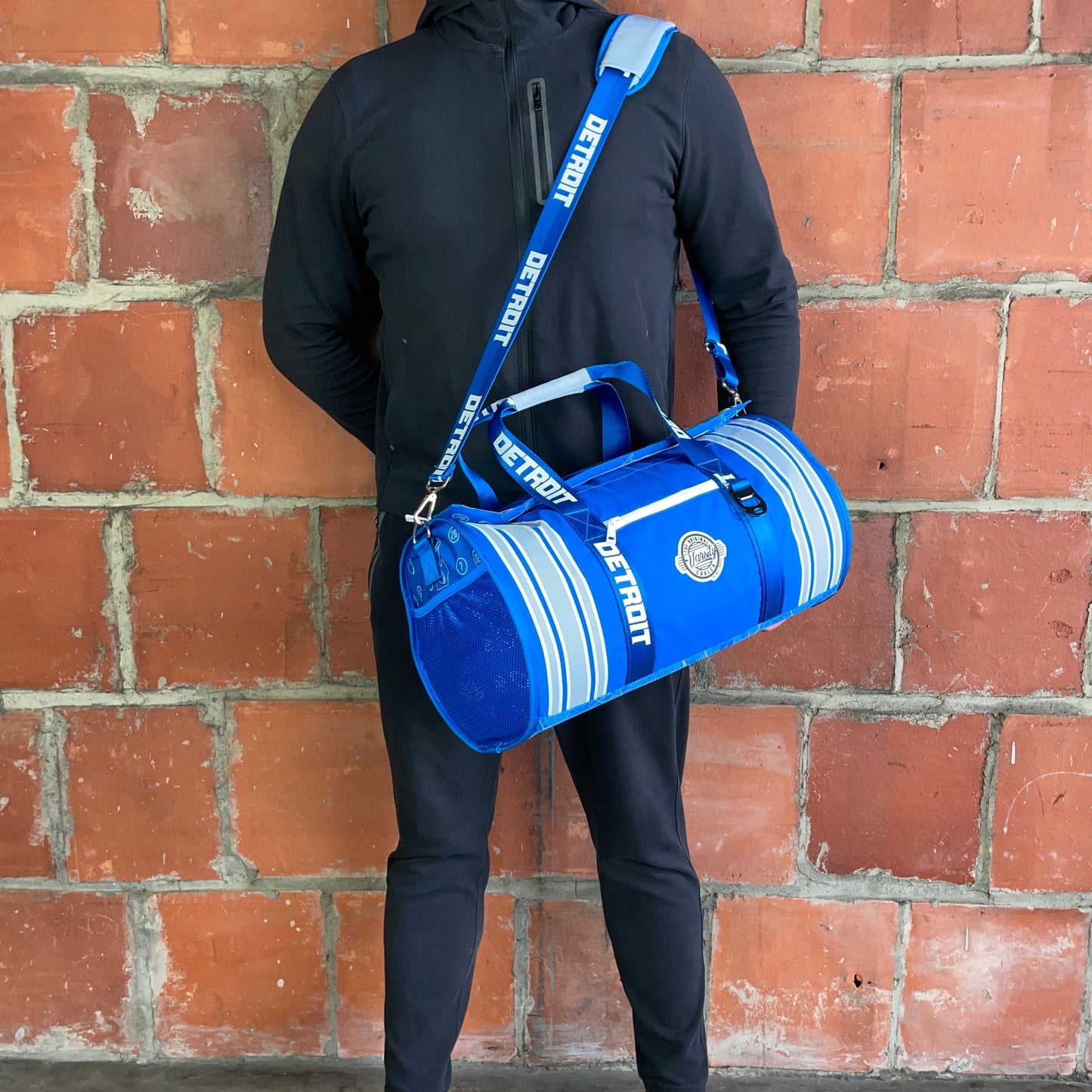 Man standing with Detroit duffle cooler