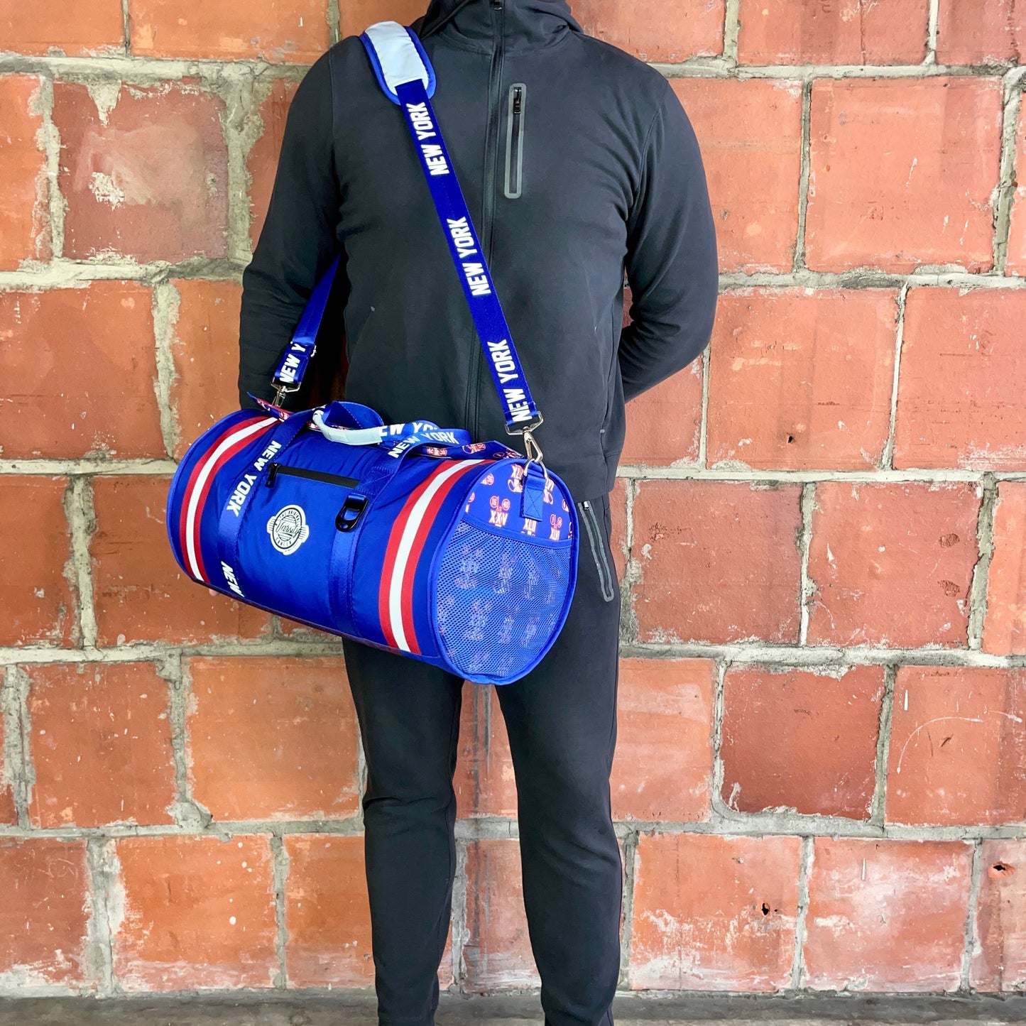 Man Standing with New York Cooler Duffle Bag