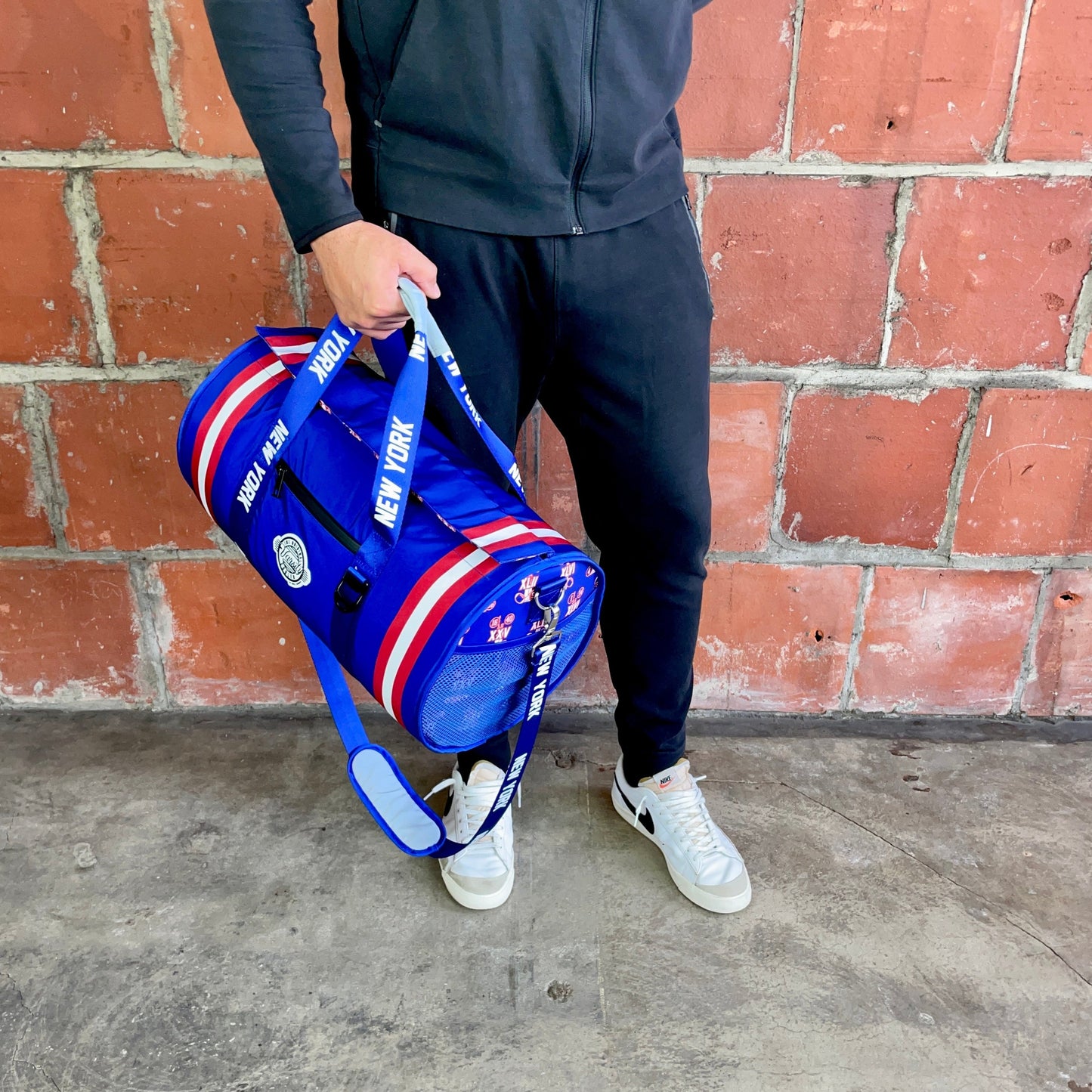 Man Holding New York Cooler Duffle Bag