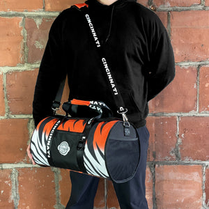 A-Man-is-Standing-with-Cincinnati-Duffle-Cooler-Bag