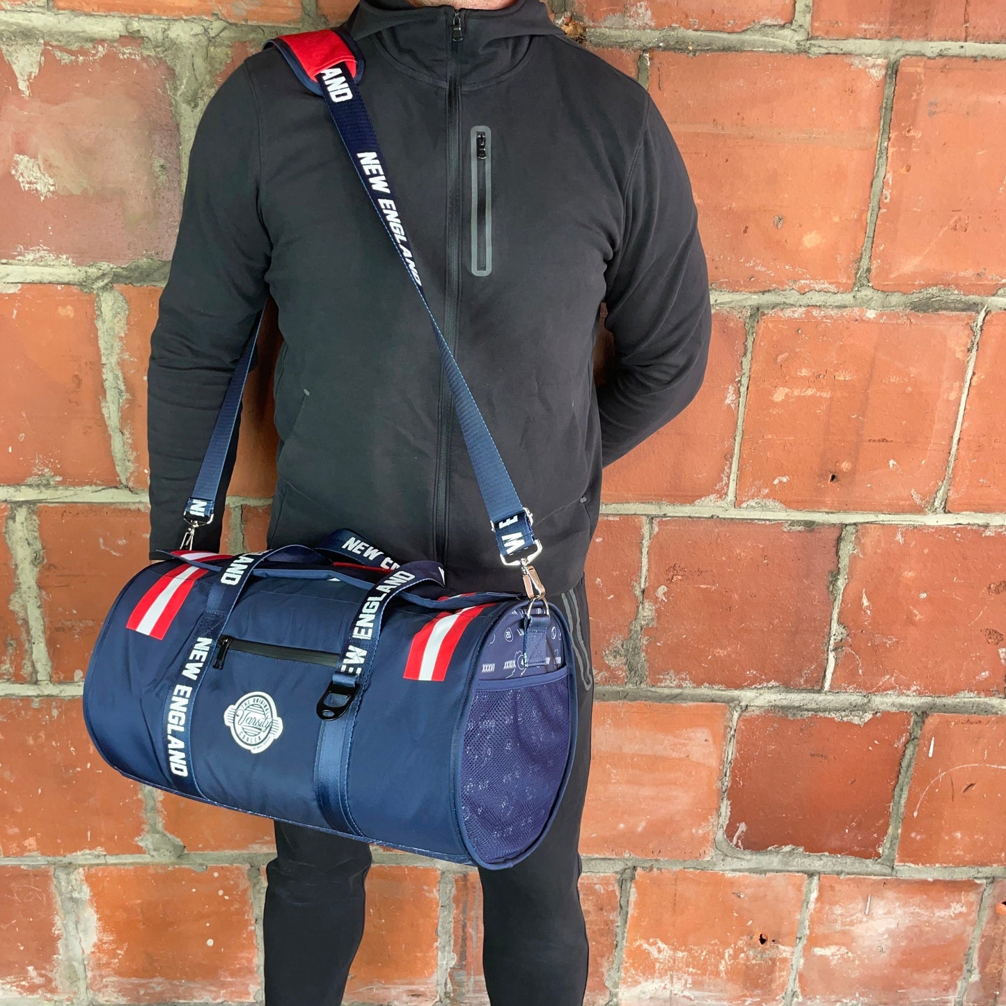 Man Standing With New England Cooler Duffle Bag