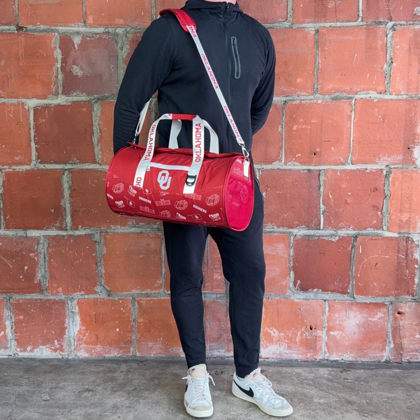 Man Standing With University of Oklahoma Duffle Cooler Bag