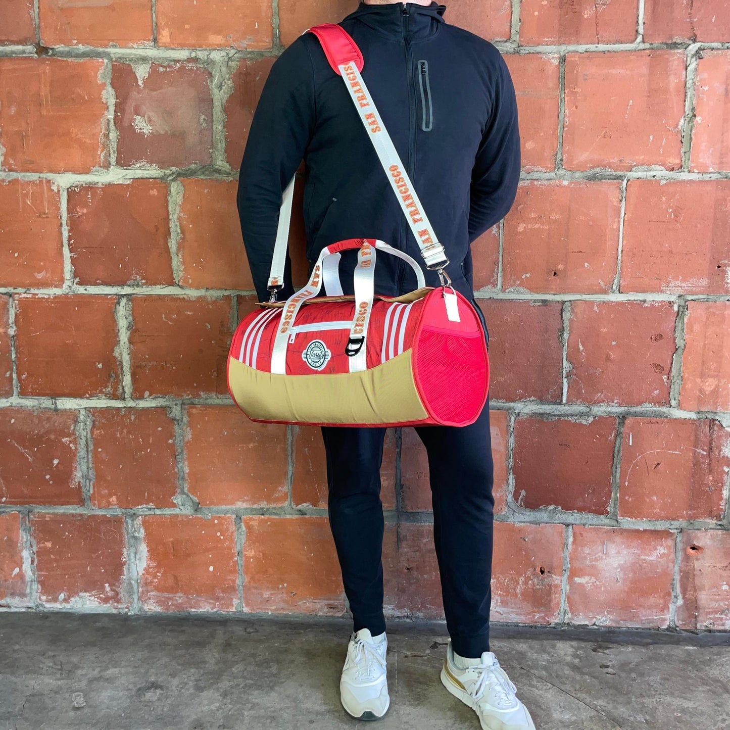Man standing with San Francisco duffle cooler