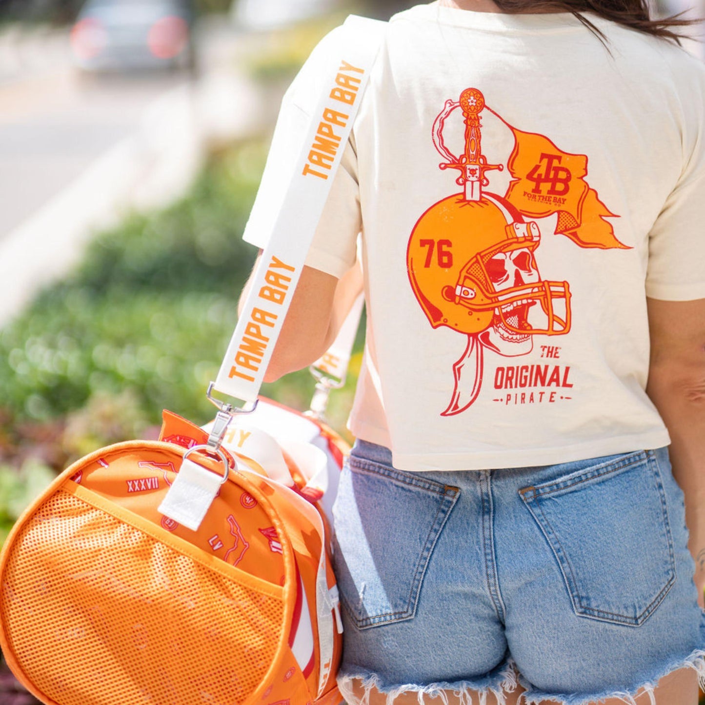 Girl carrying duffle bag cooler