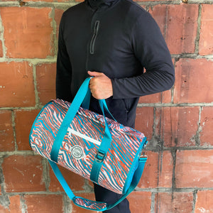 A-man-holding-a-Miami-Duffle-Cooler-with-pride