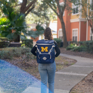 Girl-Standing-With-University-of-Michigan-Backpack-Cooler
