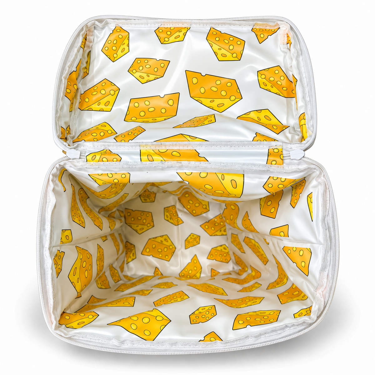Open Green Bay backpack cooler showing the yellow cheese-pattern interior liner.